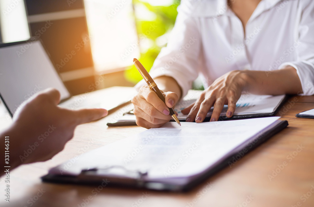 Teamwork with two business people in office with business analysis stock photo Teamwork with two business people in office with business analysis stock photo