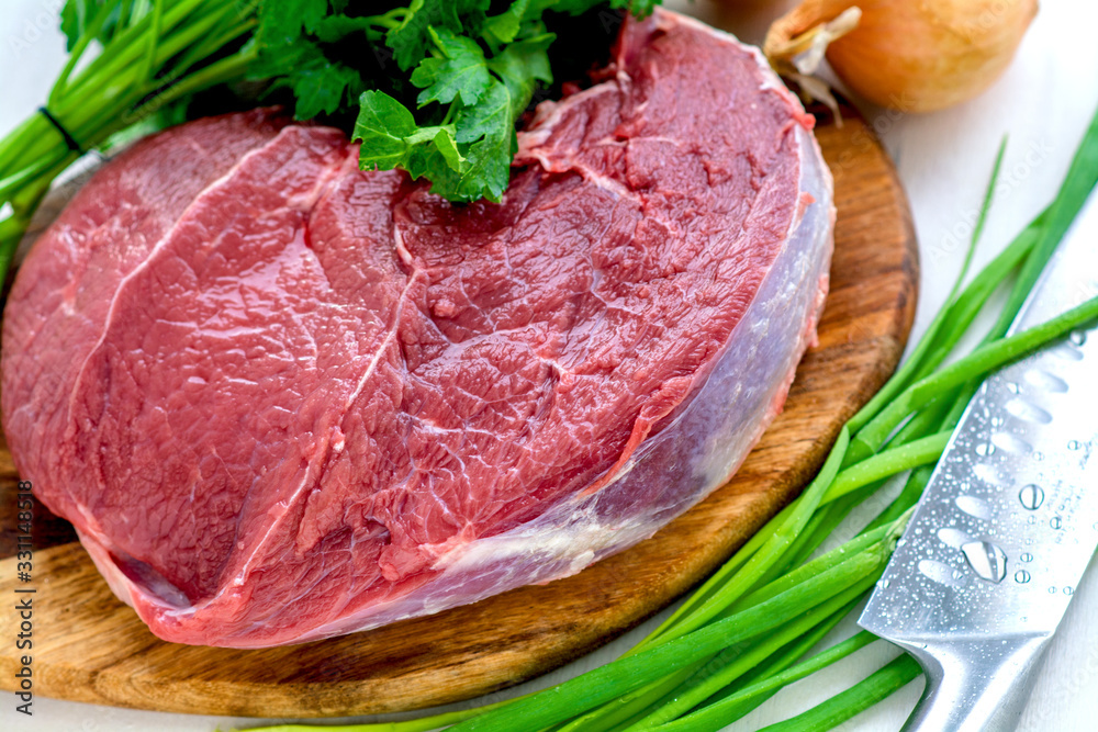 Fresh Raw Beef Steak. Green and onion parsley Fresh Raw Beef Steak. Green and onion parsley
