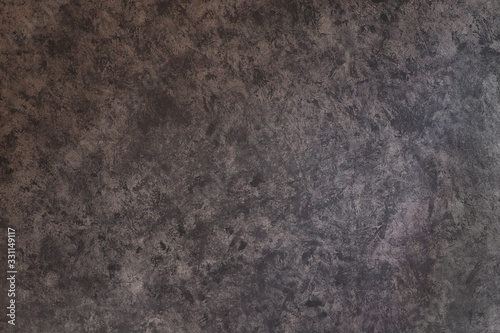 Texture of plaster painted in a heterogeneous gray color