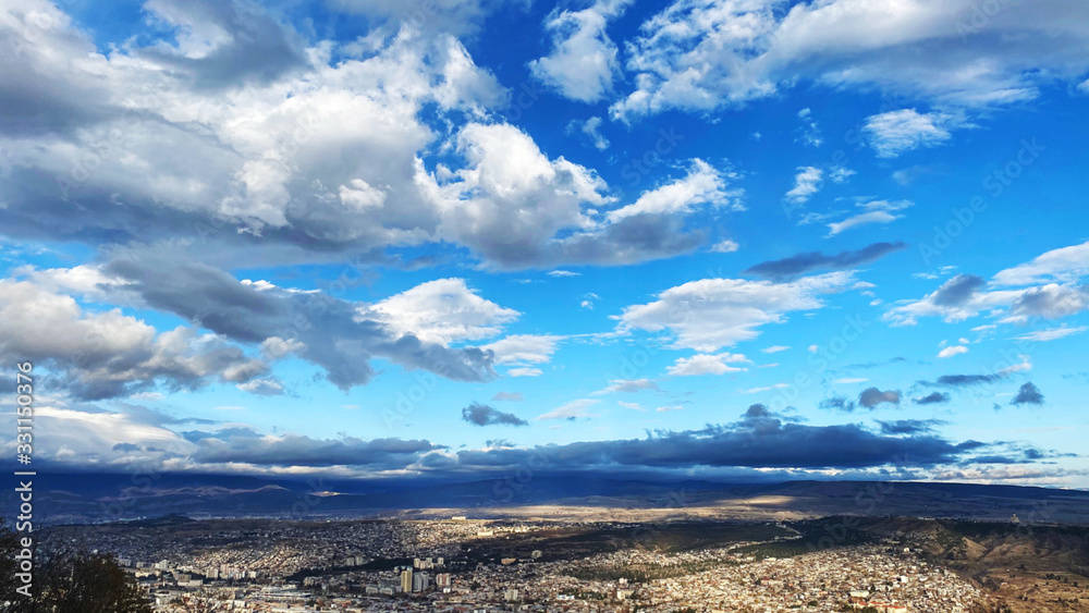 Beautiful aerial view of the central part of city  and blue sky in Tbilisi, Georgia