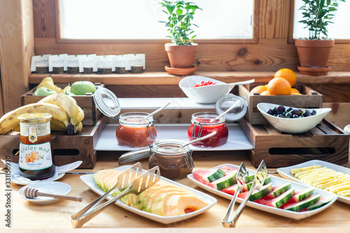 Breakfast buffet table filed with assorted foods