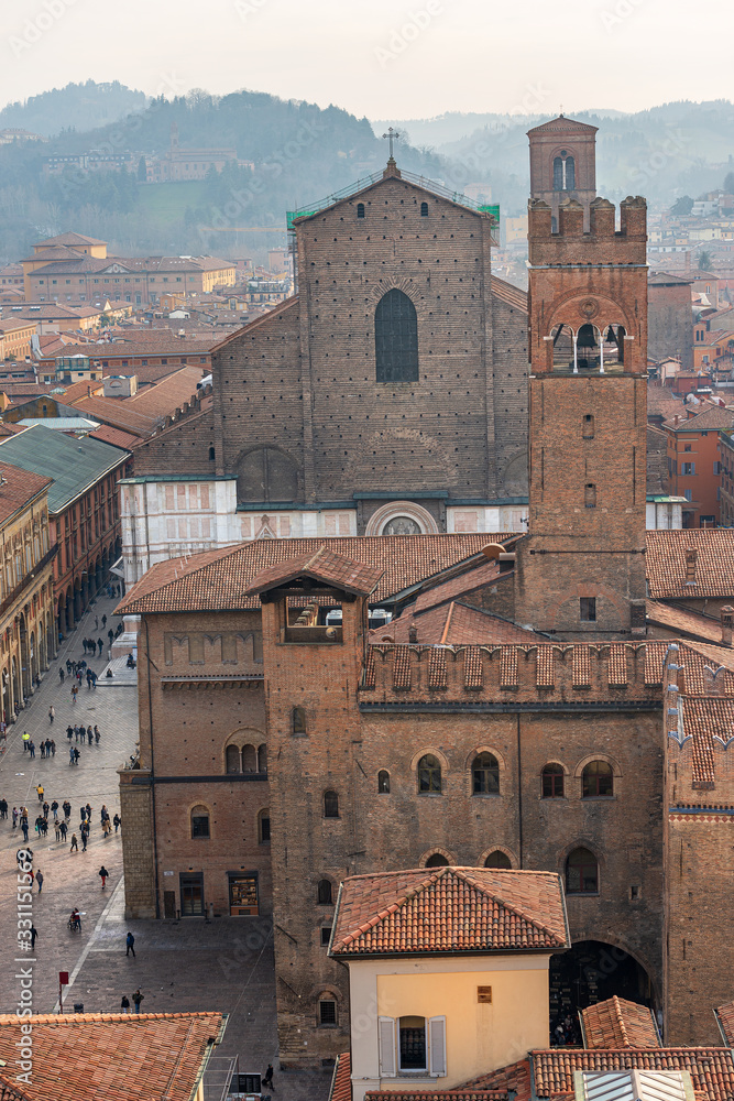 Cityscape of Bologna downtown with the Basilica of San Petronio in gothic style, Piazza Maggiore and the medieval Palazzo Re Enzo (1245) with the Arengo Tower (1259). Emilia-Romagna, Italy, Europe