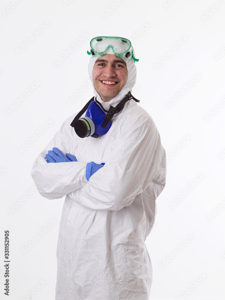 Doctor wearing protective biological suit and mask due to coronavirus white background