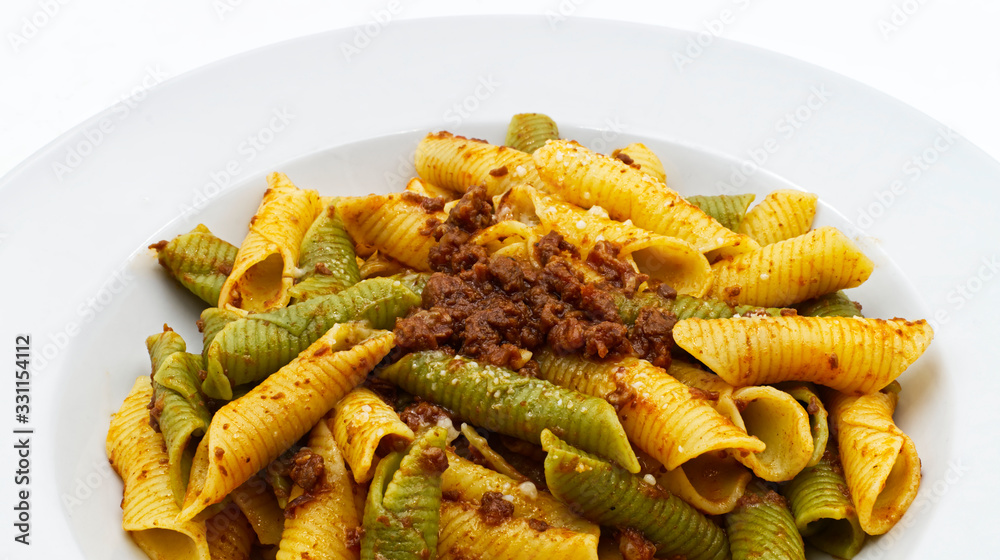 Traditional italian colorful pasta. Maccheroni al pettine, close-up Traditional italian colorful pasta. Maccheroni al pettine, close-up