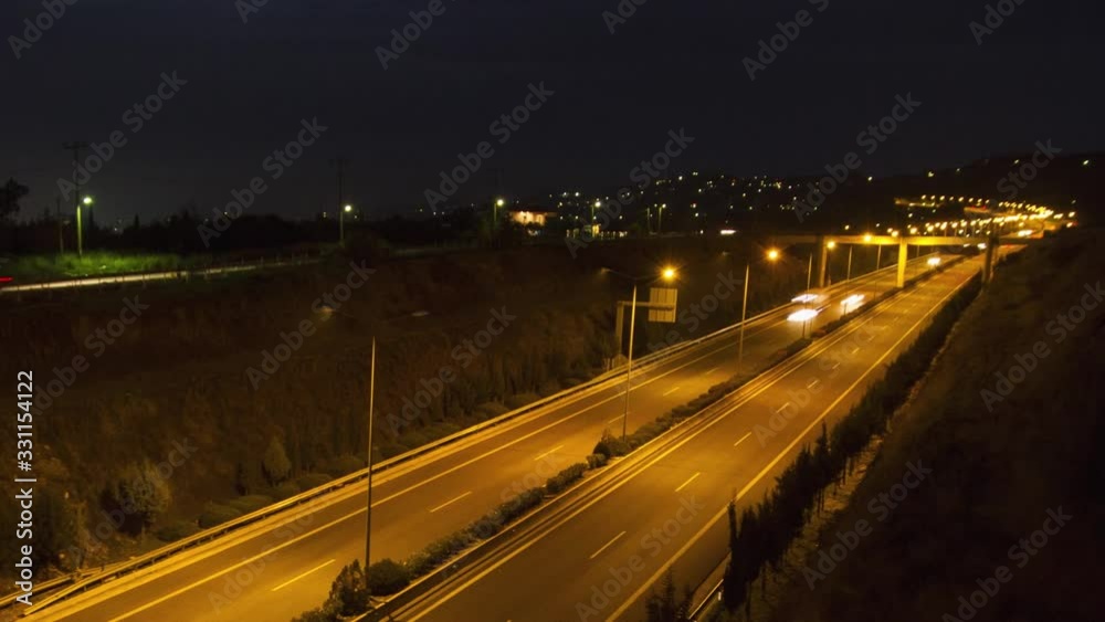 Long exposure time lapse of car lights on highway in Greece at night, zoom out Long exposure time lapse of car lights on highway in Greece at night, zoom out