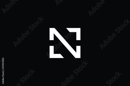 Minimal elegant monogram art logo. Outstanding professional trendy awesome artistic N initial based Alphabet icon logo. Premium Business logo White color on black background photo