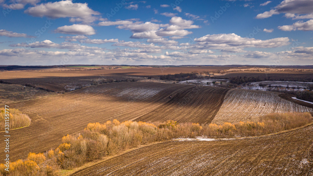 Birds eye view of Ukrainian spring field. Natural background on a sunny day.