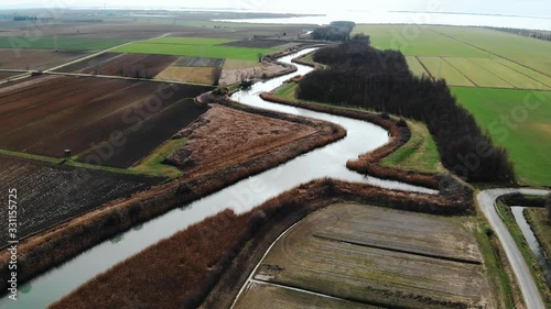 Fields, river and road in Friuli Venezia Giulia, Marano, Italy photo