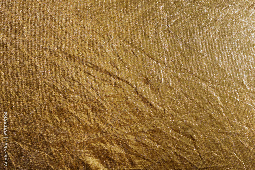 golden foil or fabric, texture suitable for gold leaf, photo reflector or foil