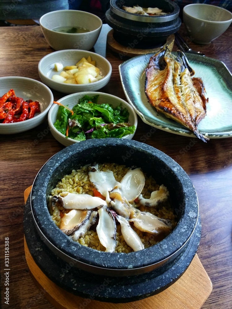 Korean hot abalone stone rice and grilled mackerel Korean hot abalone stone rice and grilled mackerel