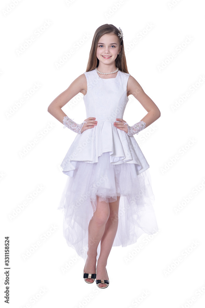 Happy beautiful little girl in white dress posing isolated 
