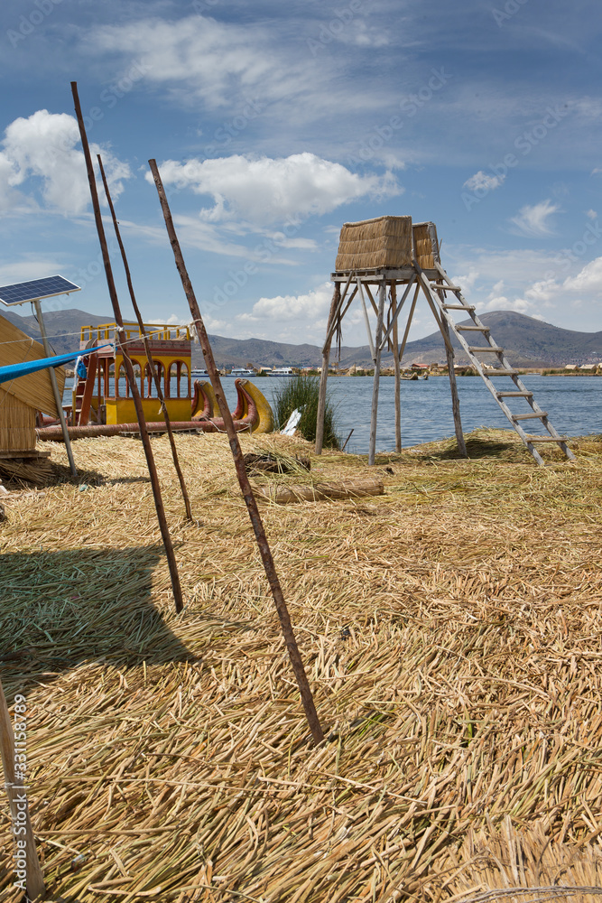 Puno Peru. Lake Titicaca. Floating village. Uros people. Reed culture. Reed houses. Puno Peru. Lake Titicaca. Floating village. Uros people. Reed culture. Reed houses.