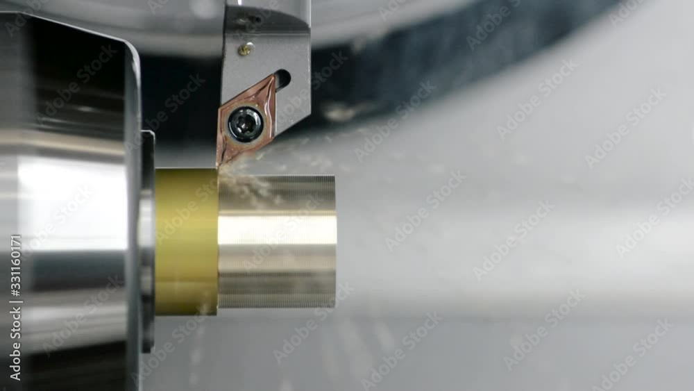 Close up view of high precision turning operation on a multi axis lathe, CNC machine tool.