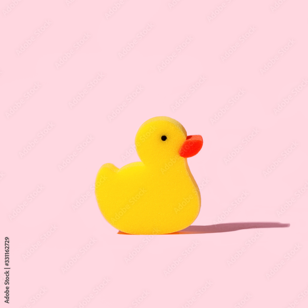 Yellow toy duck sponge or washcloth on pink background. Trendy beauty  bathtime wellness hygiene photography. Bath products set, creative modern  banner or flyer with copy space Stock Photo | Adobe Stock