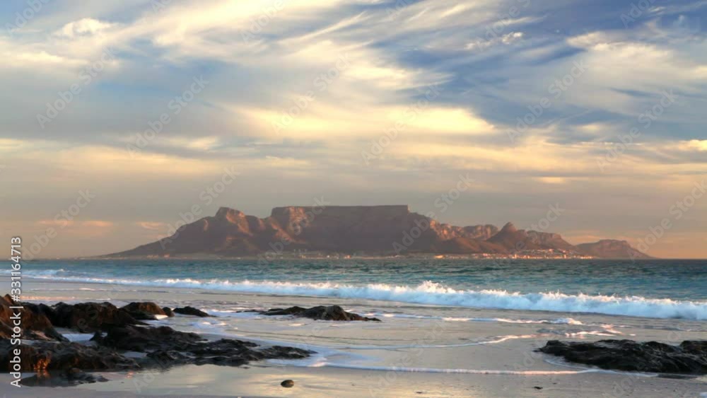 cape town table mountain scenic view from bloubergstrand with splashing waves