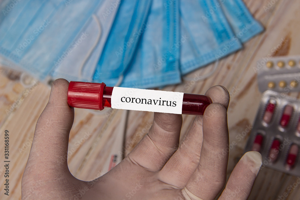 Obraz premium Blood in a test tube for coronavirus research, preventing an epidemic