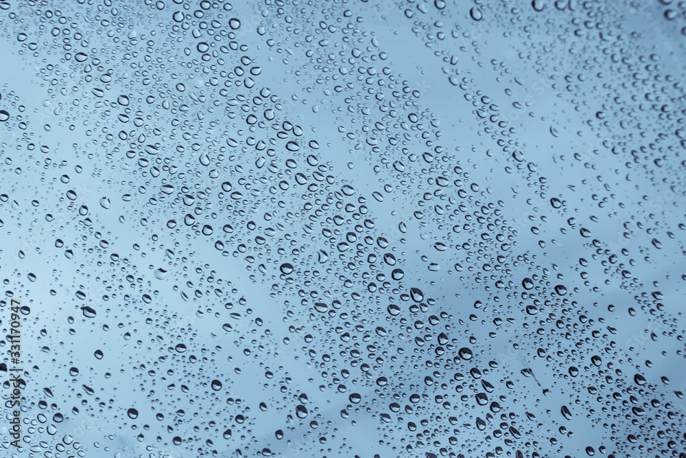 Car window glass with rain droplets background testure. Rain season concept. Car window glass with rain droplets background testure. Rain season concept.
