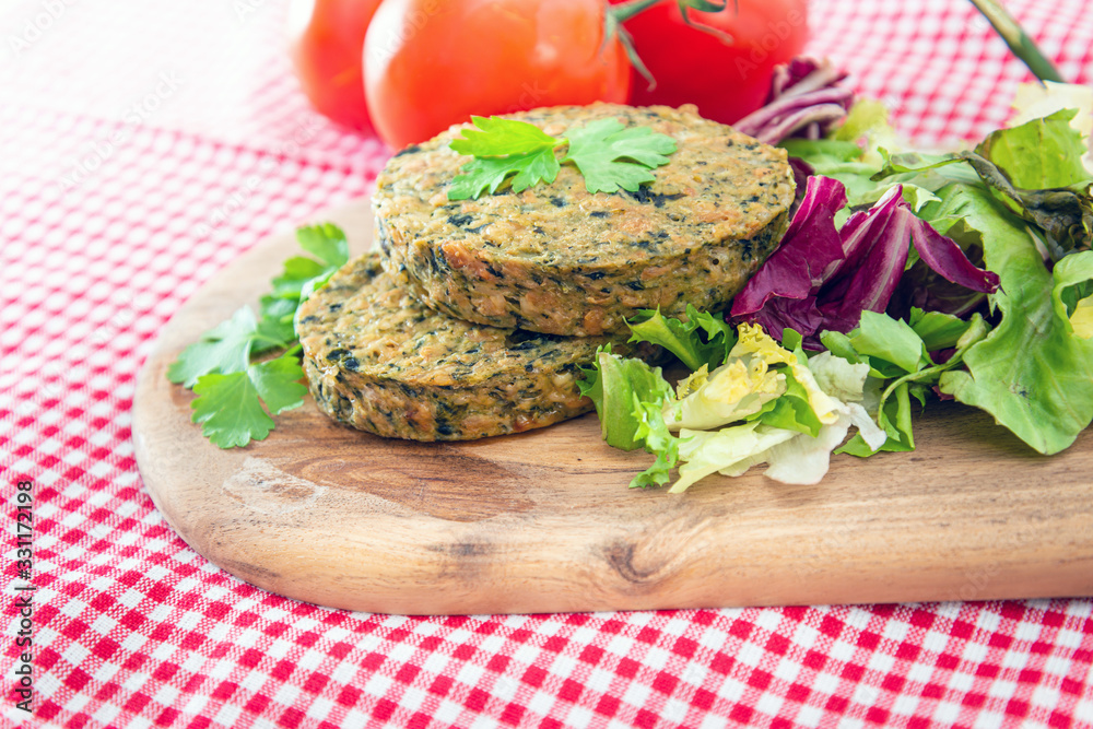 Vegetarian food Wheat Gluten Steaks with spinach Vegetarian food Wheat Gluten Steaks with spinach