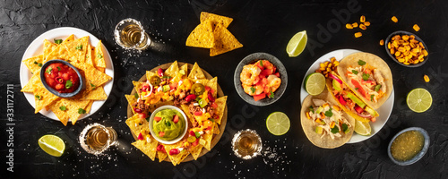 Mexican food panorama, shot from the top on a black background photo