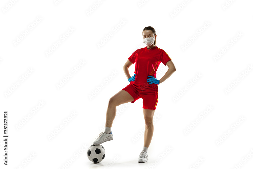 Beat the disease. Female football, soccer player in protective mask. Prevention against pneumonia. Still active while quarantine. Chinese coronavirus treatment. Healthcare, medicine, sport concept.