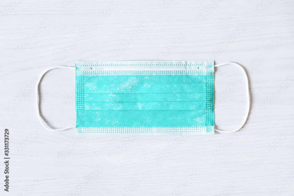 Medical mask for protection against cold and flu or other virus. Surgical protective mask top view. Medical mask for protection against cold and flu or other virus. Surgical protective mask top view.