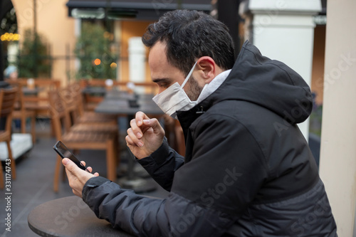 Photography The adult man wanders the streets of Istanbul with a mask to prevent infectious diseases