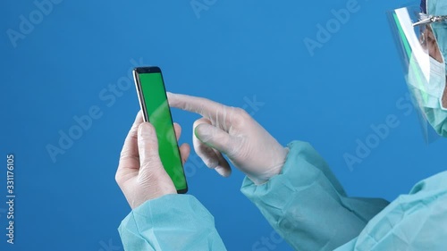 the doctor uses a smartphone in the laboratory photo