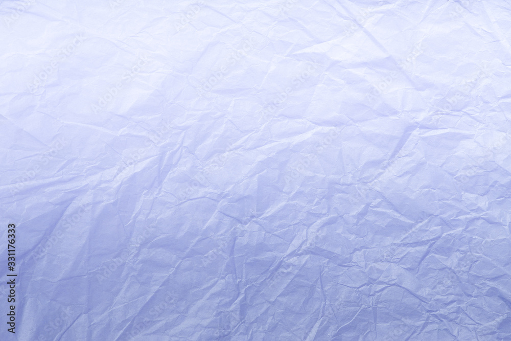 Obraz premium Texture of crumpled light blue wrapping paper, closeup. Lilac old background.