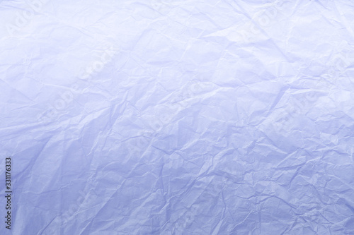 Texture of crumpled light blue wrapping paper  closeup. Lilac old background.