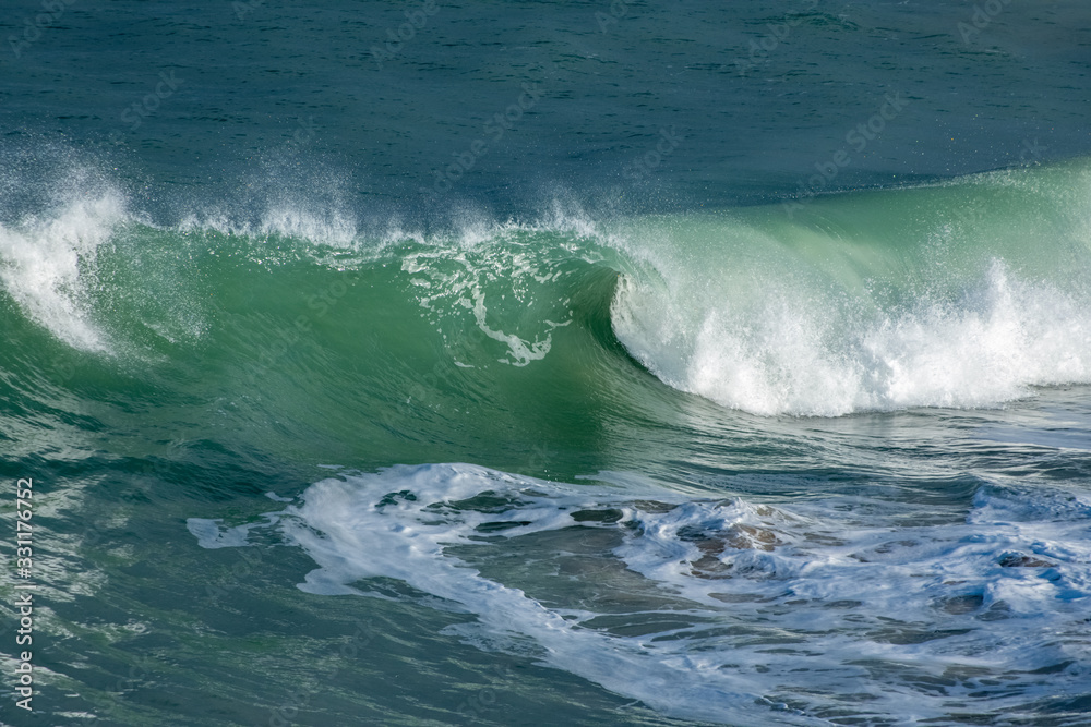 Wave curling and breaking on Cornish coast Wave curling and breaking on Cornish coast