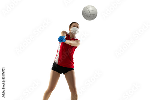 Win the desease. Volleyball player in protective mask and gloves. Prevention against pneumonia. Still active while quarantine. Chinese coronavirus treatment. Healthcare, medicine, sport concept.