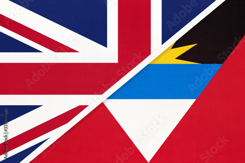 United Kingdom vs Antigua and Barbuda national flag from textile. Relationship between two countries.