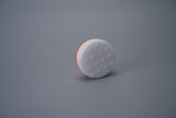 Clean sponge in the shape of a ball, isolated in the gray background