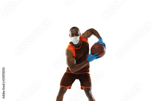 Beat it off. African-american basketball player in protective mask. Prevention against pneumonia. Still active while quarantine. Chinese coronavirus treatment. Healthcare, medicine, sport concept.