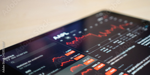 Economic impact of virus on global economy. Recession and financial crisis concept. Downtrend charts of financial instruments, daily stock market price data visualization, quotes.