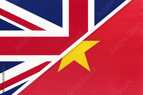 United Kingdom vs Vietnam national flag from textile. Relationship between two european and asian countries.