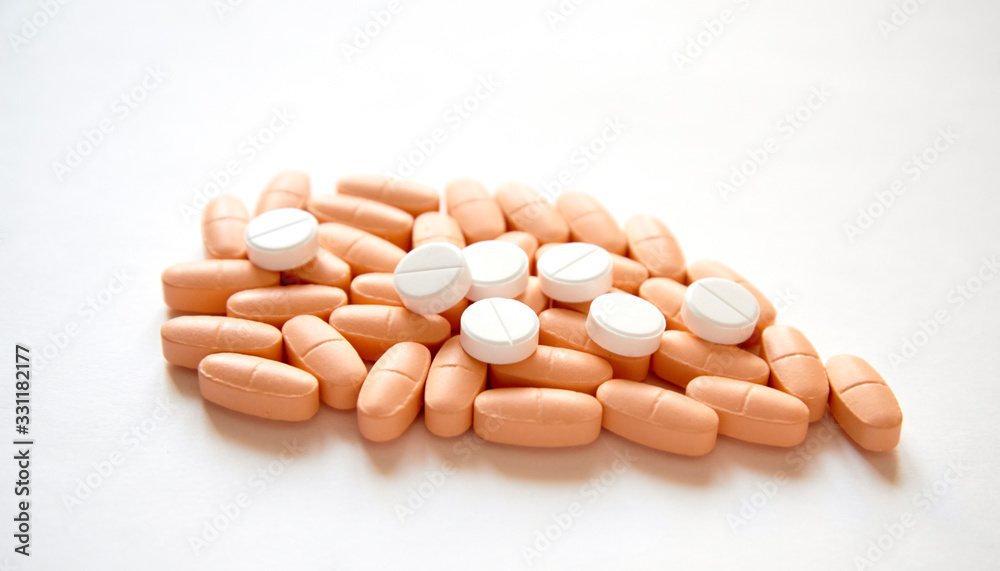 Stack of different pills on white background Stack of different pills on white background