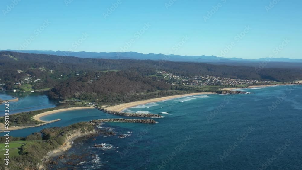 Aerial drone view of Wagonga Head and Wagonga Inlet at Narooma on the New South Wales South Coast, Australia, on a sunny day Aerial drone view of Wagonga Head and Wagonga Inlet at Narooma on the New South Wales South Coast, Australia, on a sunny day