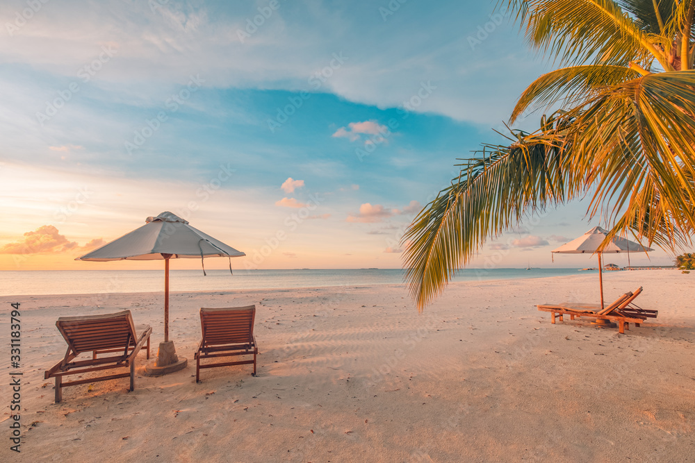 Beautiful beach. Chairs on the sandy beach near the sea. Summer holiday and vacation concept for tourism. Tranquil scenery, relaxing beach, wonderful tropical landscape design. Boost up color process