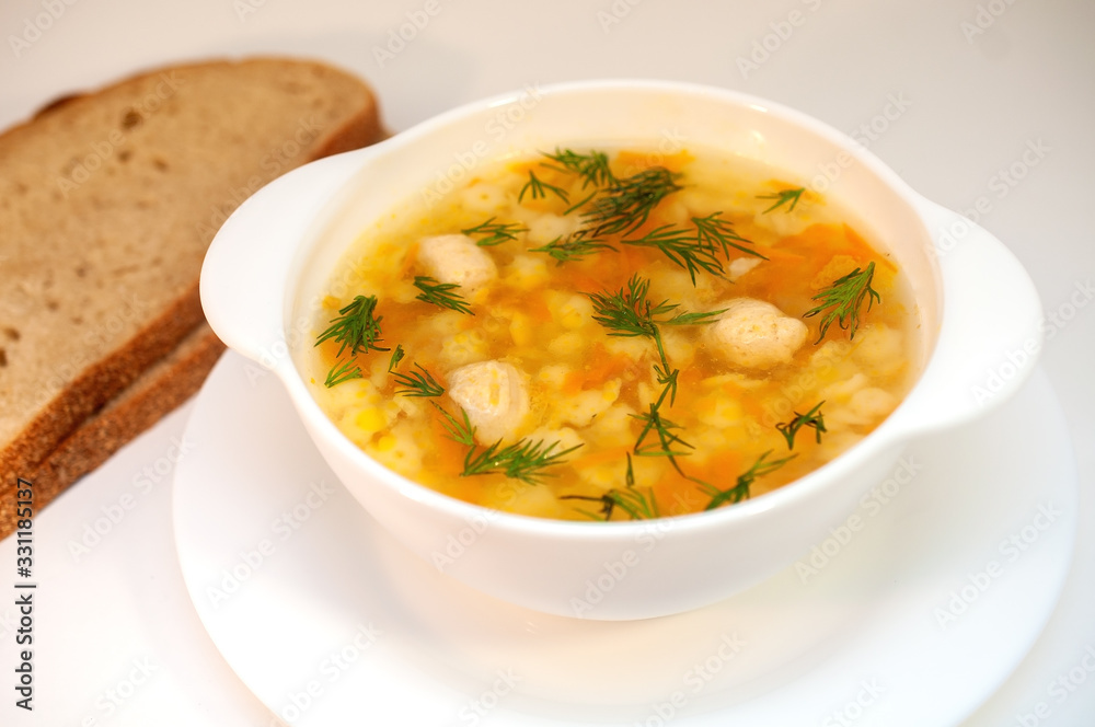 Chicken soup with meatballs and pasta on the table Chicken soup with meatballs and pasta on the table