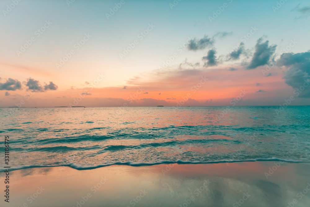 Colorful ocean beach sunrise or sunset. Peaceful tropical nature scenery, summer landscape, exotic mood. Bay with shore and calm waves