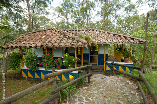 Facade of house in Comfama Tutucán Recreational Park in 2005 year, Antioquia, Colombia photo