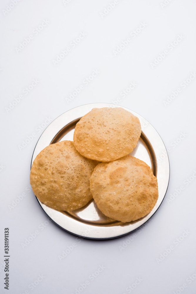 Aloo Puri or Potato curry with fried Poori, popular Indian breakfast / lunch / dinner menu.