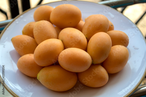 Heap of Thai plango fruit or marian plum, Fresh ripe Marian Plum photo