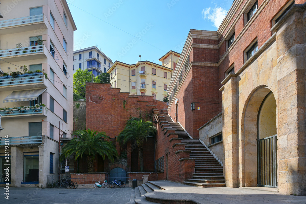 Empty street and staircase during coronavirus crisis in the old town center of La Spezia, capital city in Liguria, Italy