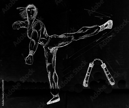 a karate wrestler kicking. In the background a nunchako photo