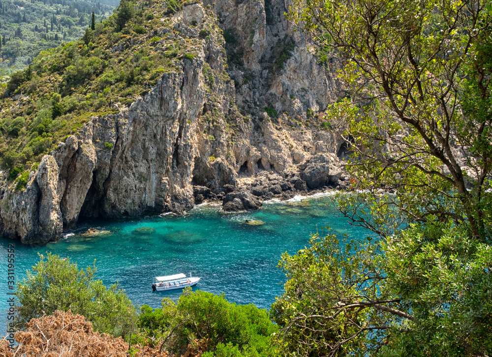 Beautiful beach and boat, Corfu island, Greece