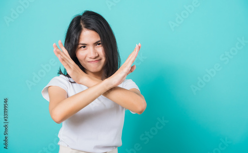 woman unhappy or confident standing, She holding two crossing arms say no X sign