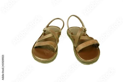 Brown leather slippers isolated on a white background.