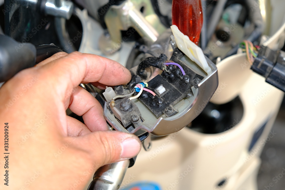 Motorcycle repair technicians check the wiring or repair of the